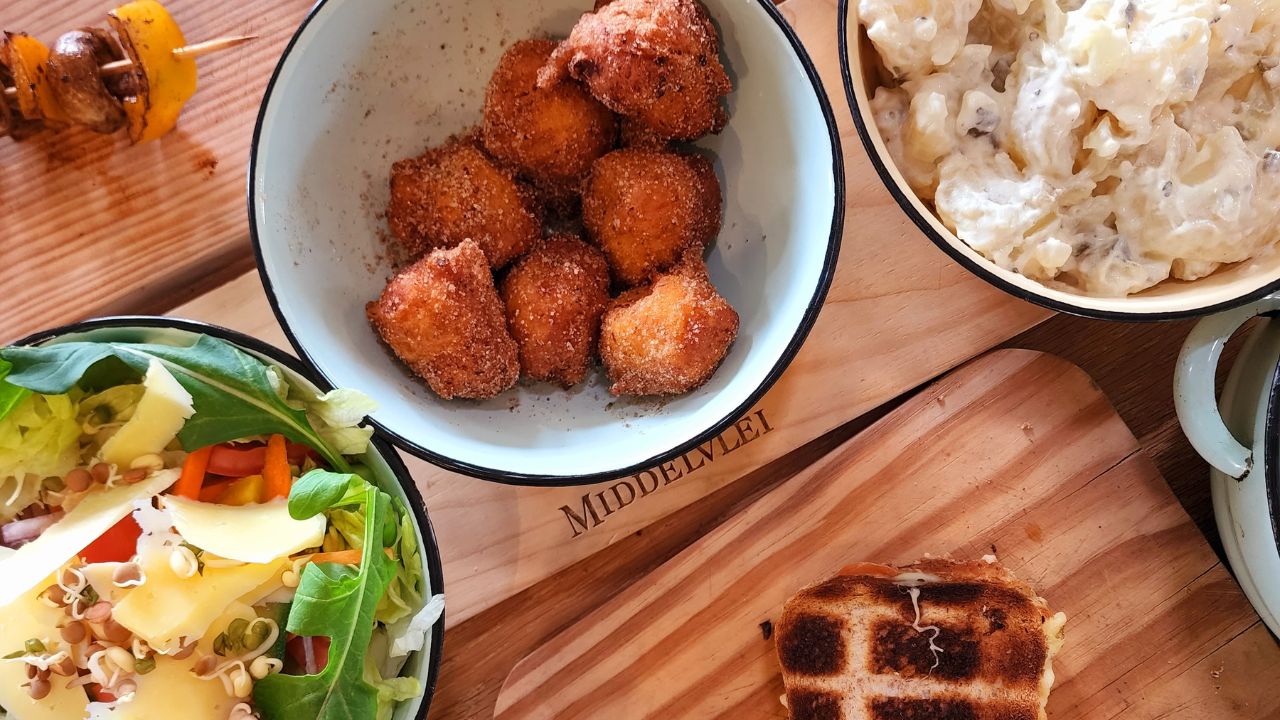 Curator-hosted long lunch at Middelvlei — hands, fire, the people who live it