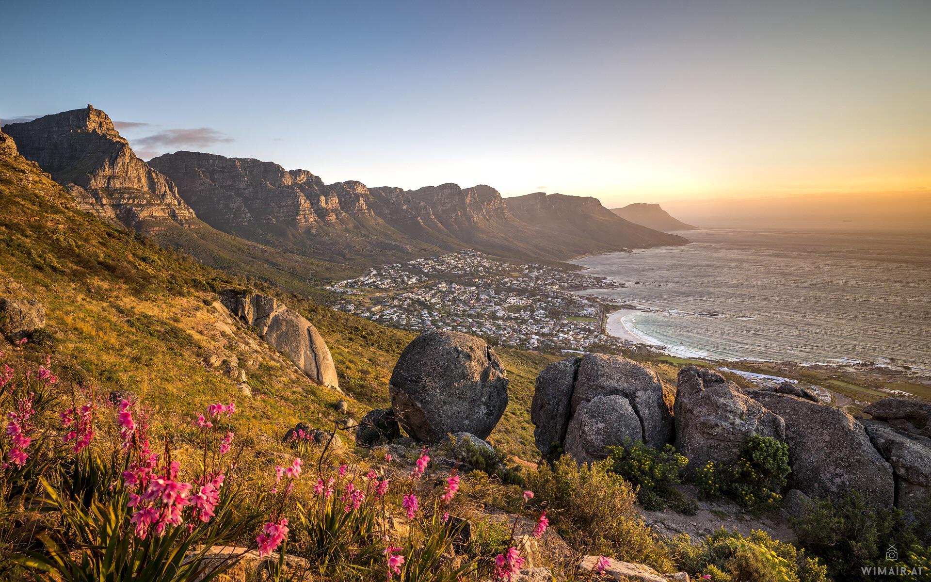 Twelve Apostles mountains meeting the sea at sunset
